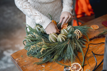 DIY masterclass covering the creation of Christmas wreaths and New Year's decorations.