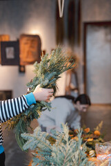 Crafting workshop focusing on Christmas wreath making and New Year's decor.