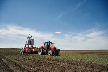 Obraz premium Driving on the field. Agricultural machinery, tractor. Conception of harvest