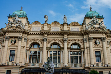 Classical facade of Juliusz Slowacki Theatre adorned with statues in Krakow, Poland