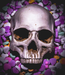 Naklejka premium Skull in a pile of Valentine's Day candy hearts February 14th holiday theme