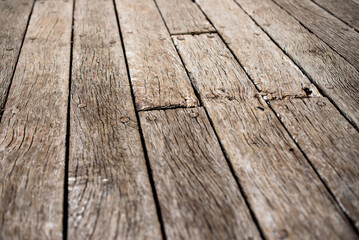 an old, wooden surface is covered in cracks and scratches