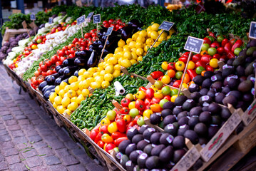 a produce stand with many different fruits and vegetables for sale