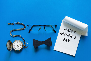 happy fathers day concept. glasses, bow tie and vintage pocket watch