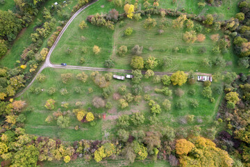 Aerial view of scenic green valley with abundant foliage and residential buildings