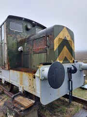 Vertical of a vintage locomotive on a railway on a cloudy day