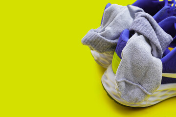 Blue sneakers with dirty socks