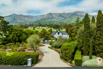 Fototapeta premium an aerial view of a residential property with the mountains in the background