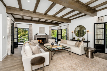 the living room has a fireplace and windows and an abundance of natural light