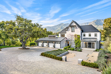 an aerial photo shows a house with driveways and trees