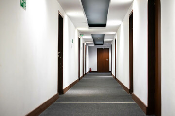 corridor in a hotel painted with white paint