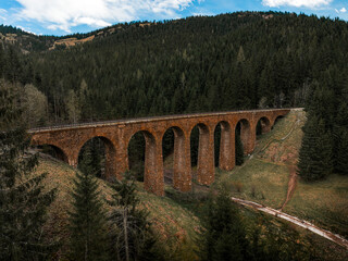 Fototapeta na wymiar Railway viaduct, bridge, situated in the forest in Telgart, Slovakia, Chmarossky viadukt.