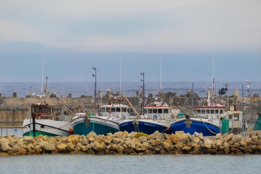 Docked near rocky shoreline in Gansbaai, South Africa
