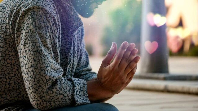 a Muslim man prays fervently