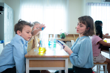 Obraz premium Teacher and students, Learn and experiment with science in a school science classroom.