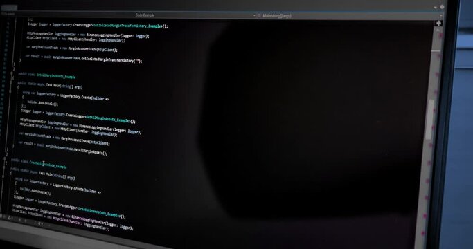 hacker scrolls program code on notebook computer, cyber security concept
