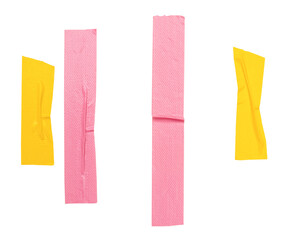 Naklejka premium Top view set of wrinkled yellow and pink adhesive vinyl tape or cloth tape in stripes shape isolated on white background with clipping path