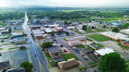 Gentry avenue along historic downtown of Checotah in McIntosh County, Oklahoma under foggy misty...
