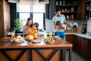 Kids and parents at breakfast.