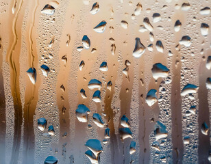 Raindrops floating on the misty glass.