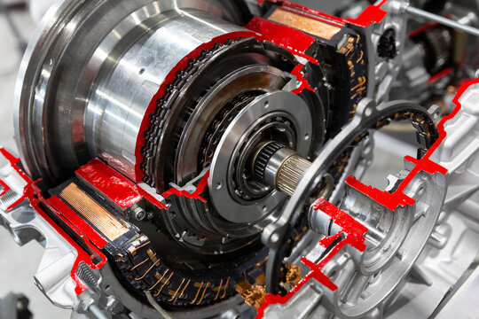 Hybrid traction head with clutch electric motor auto transmissio