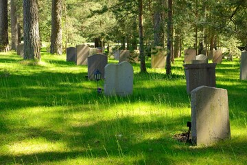 Beautiful summer view of a row of gravestones at Unesco heritage Woodland cemerery in Stockholm -...