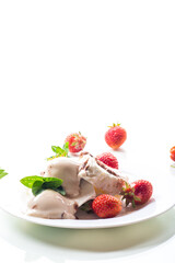 fresh organic cottage cheese with strawberries and ice cream in a plate