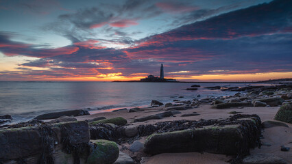 Sunrise over St Mary's Lighthouse and island at Whitley Bay on the north east coast of England, UK.
