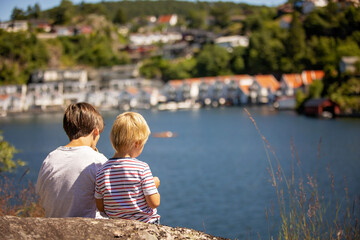 Children, family, visiting small village Flekkefjord during summer vacation