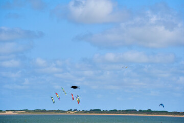 Kites in the sky. Event with revolution toy in the air. Netherlands, Zeeland, Brouwersdam.
