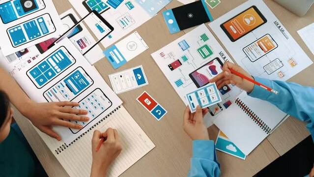 Top view panorama video of startup company employee planning on user interface prototype for mobile application or website in office. UX UI designer brainstorm user friendly interface plan. Synergic