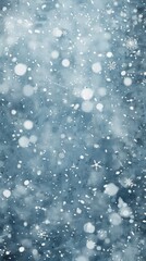 A blue background with snowflakes falling on it