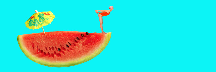 Young girl in swimsuit preparing to dive off giant slice of watermelon with cocktail umbrella...