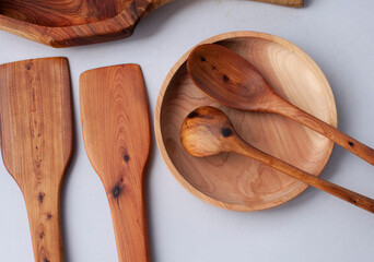 Wooden kitchen utensils stacked view, spoon and spatula