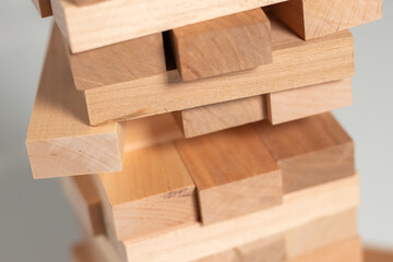 Close up take one block on The tower from wooden blocks.