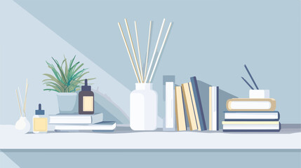 Reed diffuser notebooks and magazines on white shelf