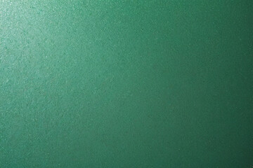 A textured background with a sparkling green surface that hints at freshness and vitality