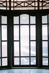 A large glass window, inviting natural light and offering panoramic views, perfect for modern architectural designs and interior decor inspiration.