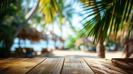 Empty wooden table top for product display, presentation stage. Tropical summer, palm trees, beach bar, white sand and blue ocean in the background. 