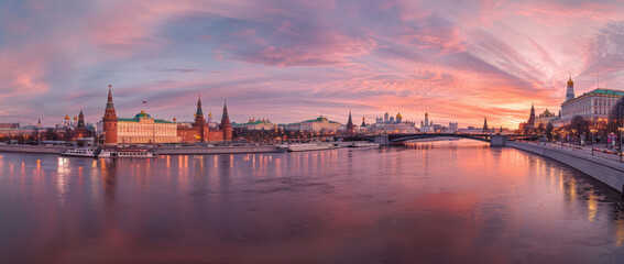 panoramic view of Moscow city, embankment with bridge and the Kremlin at sunset.