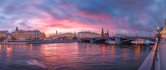panoramic view of Moscow city, embankment with bridge and the Kremlin at sunset.