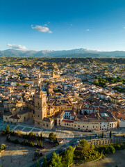 Vertical drone perspective of medieval city Guadix. Situated in Granada province, Spain is a famous travel destination. Sunset point with warm colours reflecting on budlings. Sierra Nevada Mountain
