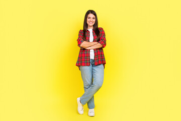 Full length photo of confident attractive lady dressed checkered shirt arms crossed empty space...