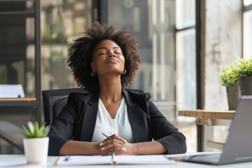 Business Wellness. Young Black Woman Meditating in Office Setting for Productive Work Day