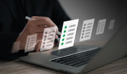Professional managing documents and tasks on a laptop with Digital Management System (DMS)....