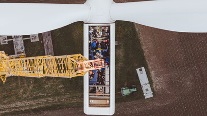 Green wind energy from renewable sources and zero carbon footprint. Wind turbine repaired by...