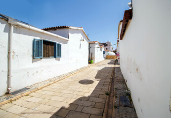 Fototapeta premium Narrow streets of historical Samanbahce houses in Lefkosa Cyprus in sunny day