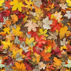 A dense carpet of autumn leaves, showcasing a rich spectrum of fall colors from deep reds to golden yellows, creating a warm, textural background. Seamless pattern wallpaper background.