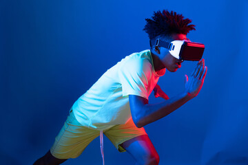 Young African American sport runner wearing VR running exercise run jogging racing competition on...