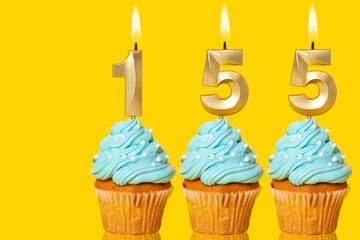 Birthday Cupcakes With Candles Lit Forming The Number 155